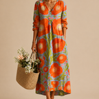 Close-up of the Faye Lightweight Layered Linen Midi Dress showcasing the soft lightweight linen fabric, layered construction, and elegant detailing. Designed by Bella Hudson.