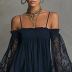 Close-up detail of the Fenella Mini Dress Off-Shoulder Lace Puff-Sleeve Boho in navy blue, featuring the off-the-shoulder neckline, gathered bodice, sheer lace sleeves, and delicate scalloped trim. Designed by Bella Hudson.