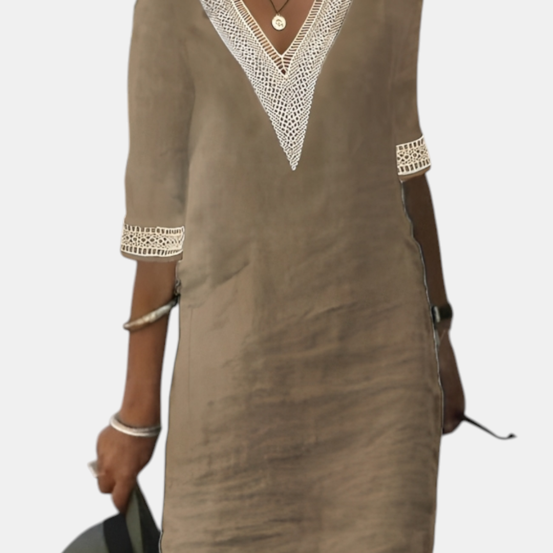 Front detail view of the Fenna Shift Dress Cotton Crochet-Trim V-Neck in khaki, showcasing the crochet-trim neckline, rolled sleeves, practical side pockets, and relaxed everyday silhouette. Designed by Bella Hudson.