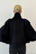 Fiona Black cropped jacket shown from the back with raglan sleeves and a center back seam.