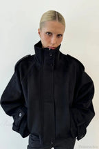 Fiona Black cropped stand-collar jacket shown from the front with buttoned collar, shoulder tabs and cuff tabs.