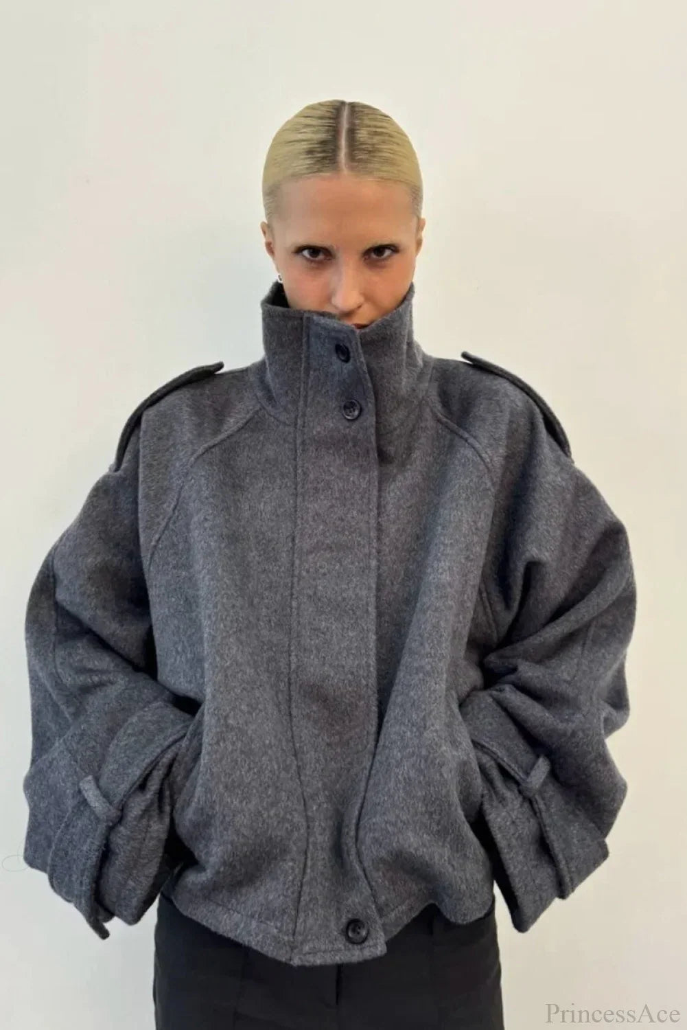 Fiona Gray cropped stand-collar jacket shown from the front with button closure, shoulder tabs and cuff straps.
