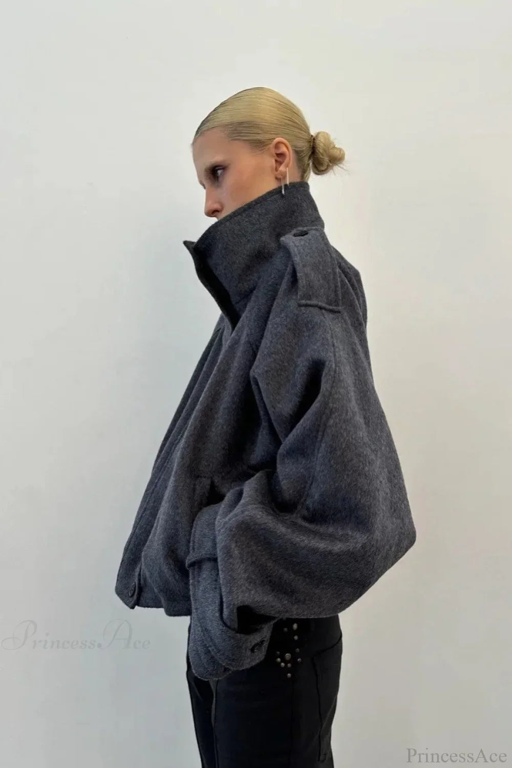 Fiona Gray cropped jacket shown from the side with a high collar and gathered hem.