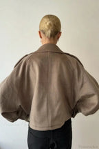 Fiona Khaki cropped jacket shown from the back with raglan sleeves and a center back seam.