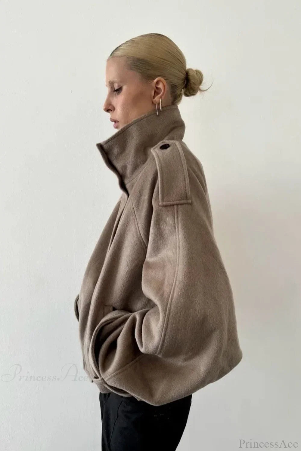 Fiona Khaki cropped jacket shown from the side with a shoulder tab and relaxed voluminous sleeve.