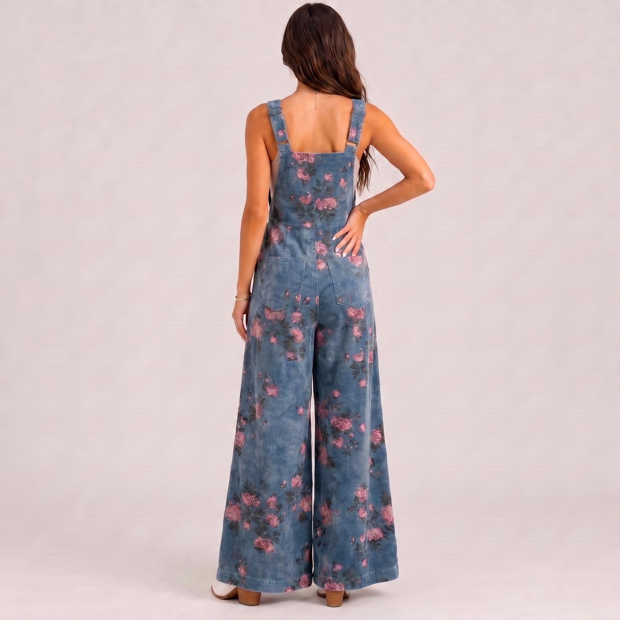 Back view of floral overalls casual jumpsuit with wide leg relaxed silhouette BELLA HUDSON