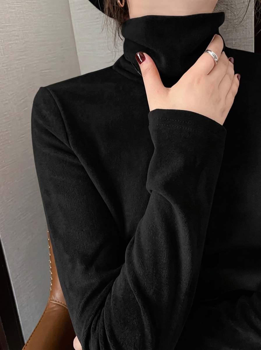 Freya Black turtleneck top with long sleeves and a classic folded collar