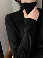 Freya Black turtleneck top with long sleeves and a classic folded collar