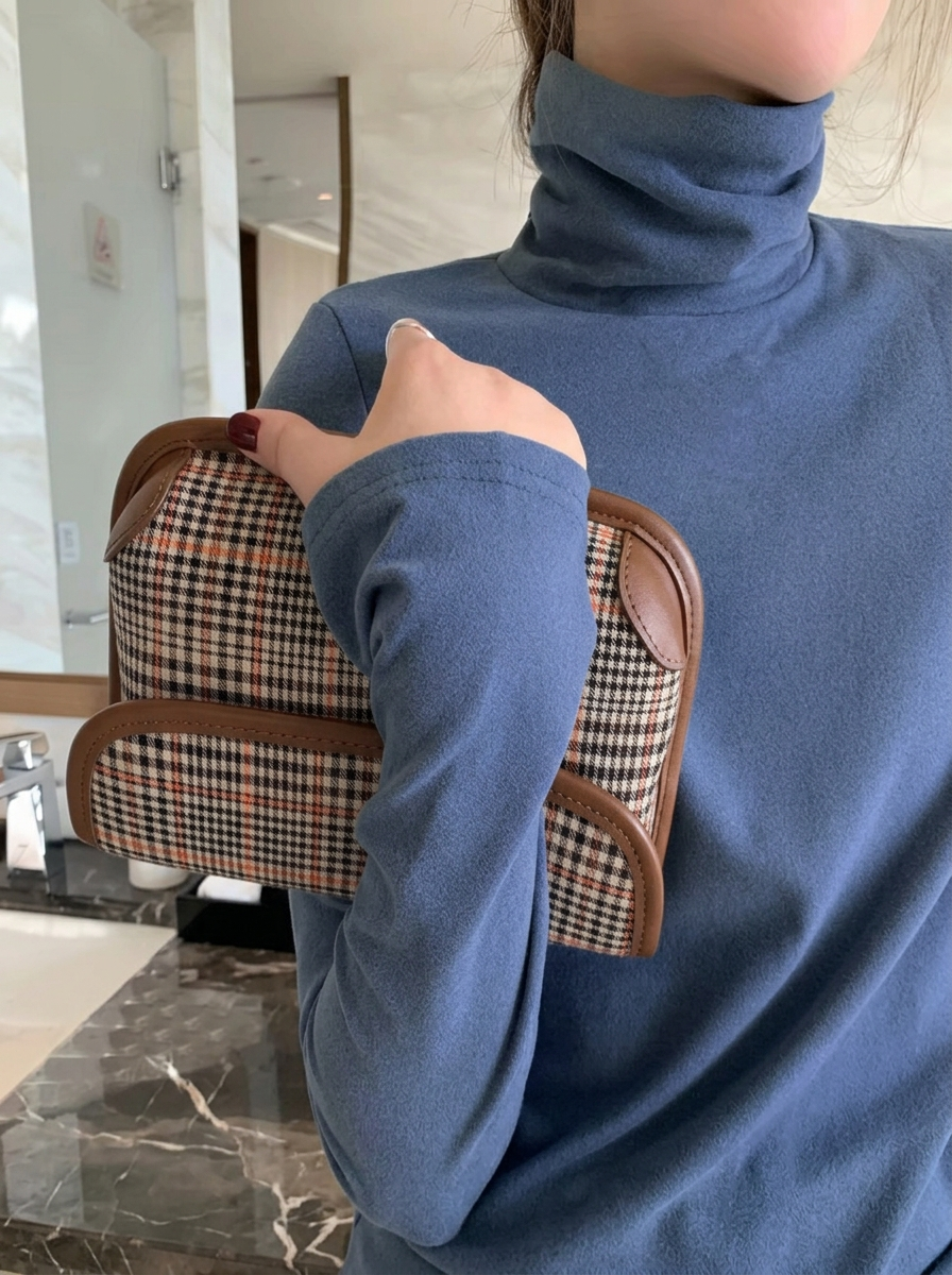 Freya Blue turtleneck top with a relaxed silhouette and high neckline