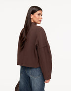 Freya Brown cropped V-neck jacket from the back, showing the dropped shoulders, sleeve seams and straight cropped hem.