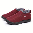 Freya Red ankle boots with quilted upper, plush faux-fur lining, rounded toe, slip-on design, and thick textured sole
