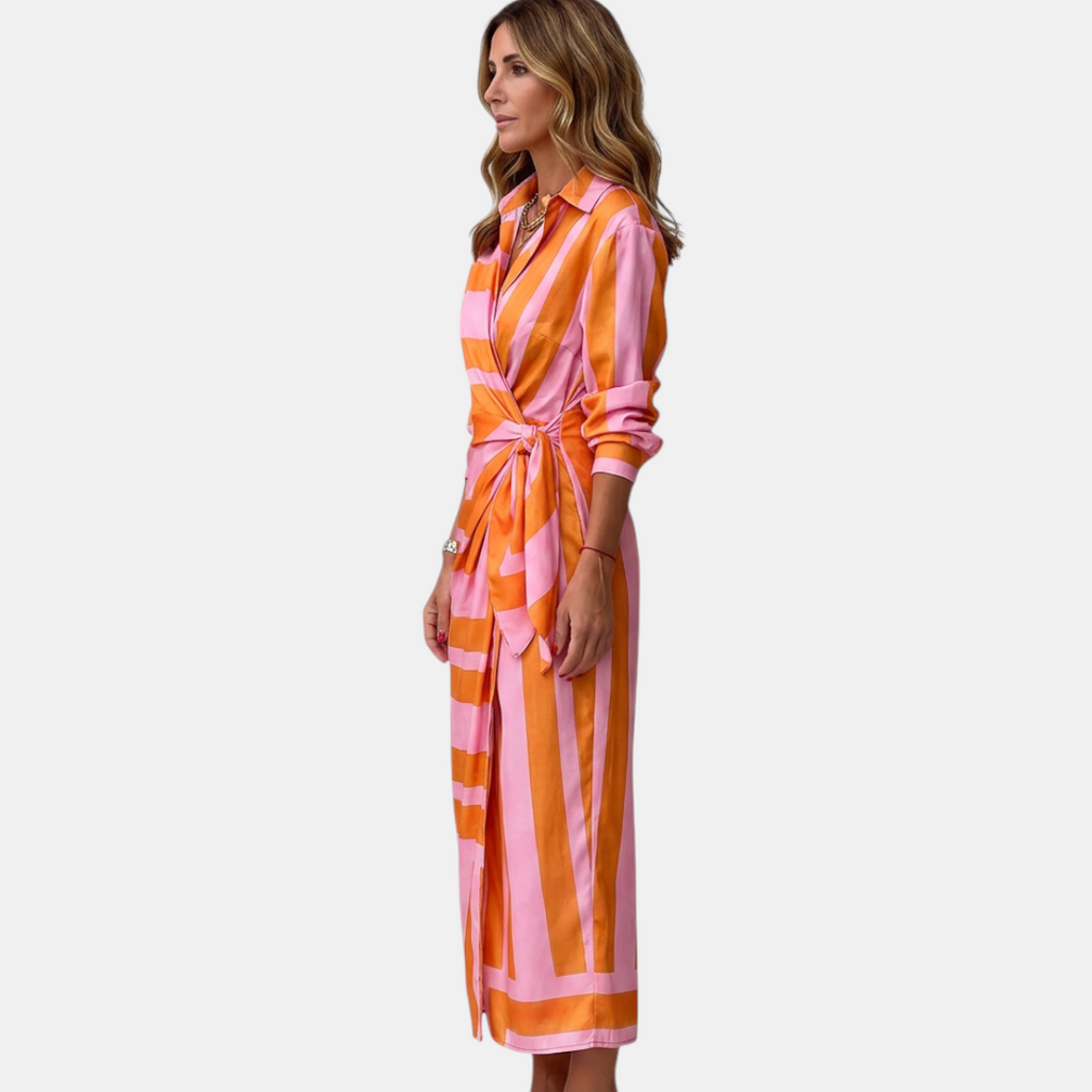 Side view of the Freya Summer Midi Dress Striped Wrap in orange, showcasing the wrap waist tie, collared neckline, long sleeves, and elegant midi-length profile. Designed by Bella Hudson.