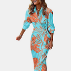 Front view of the Freya Summer Midi Dress Striped Wrap in turquoise, featuring a collared neckline, wrap waist tie, long sleeves, and a vibrant striped print. Designed by Bella Hudson.