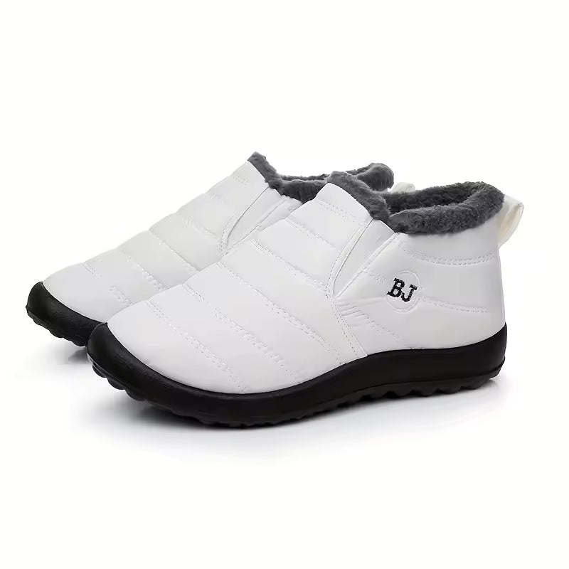 Freya white ankle boots with quilted upper, plush faux-fur lining, rounded toe, slip-on design, and thick textured sole