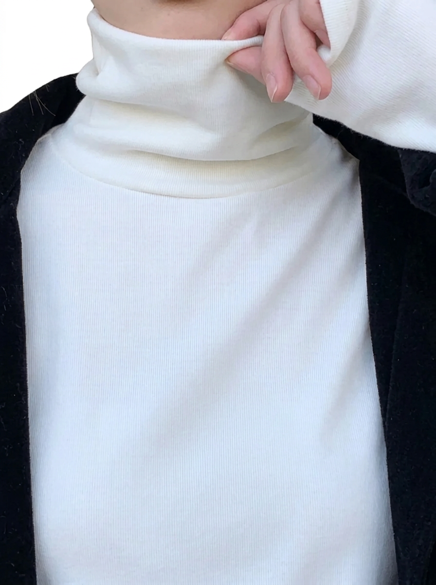 Freya White turtleneck top with a high neckline and relaxed pullover design