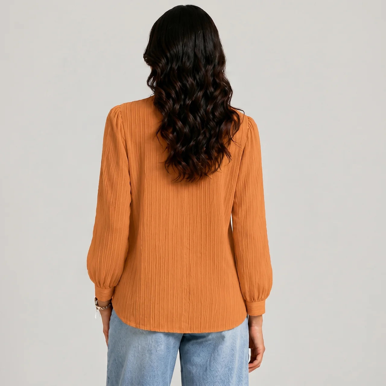 Back view of gold boho button blouse with long sleeves and textured fabric by BELLA HUDSON