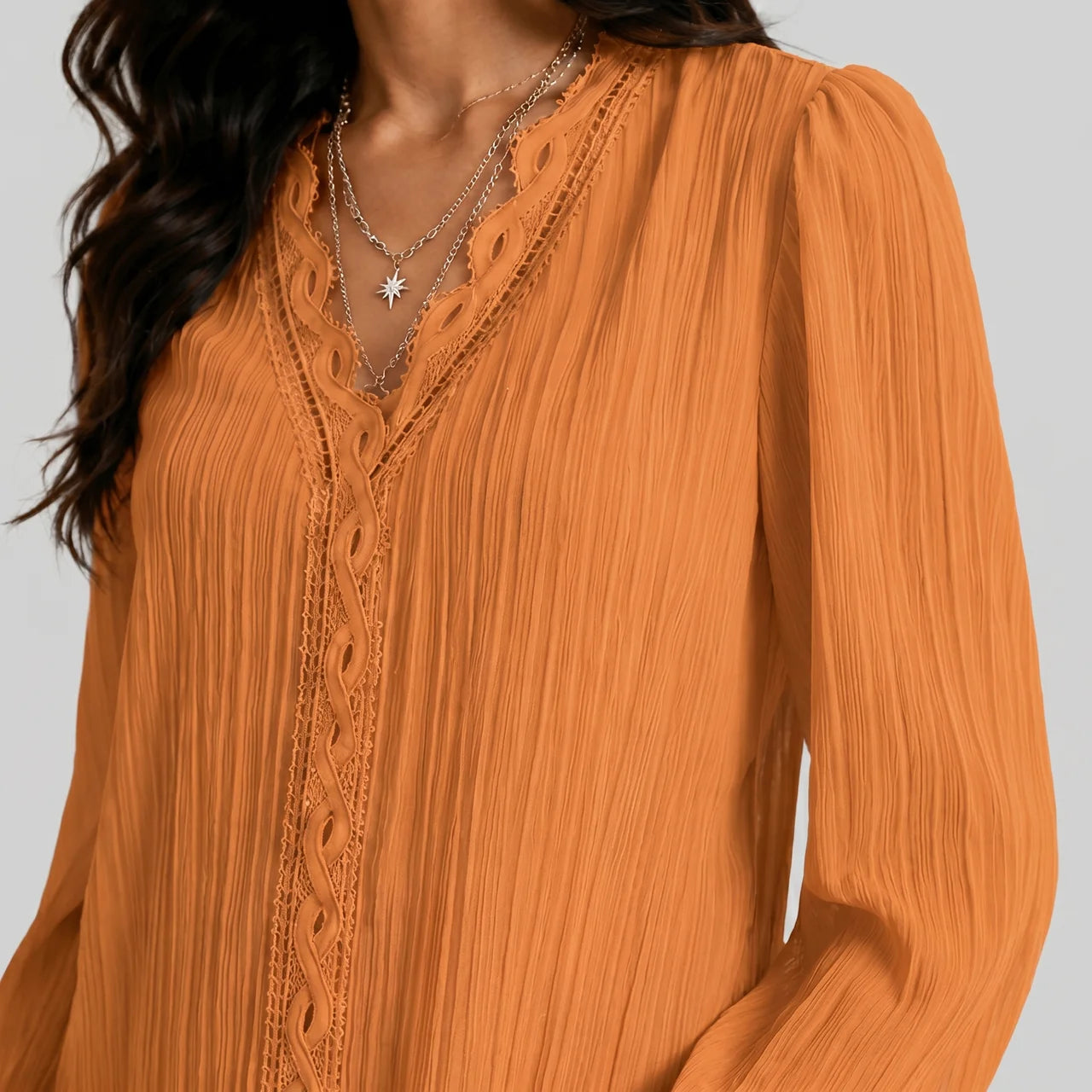 Close-up view of gold boho button blouse with long sleeves and textured fabric by BELLA HUDSON