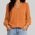 Front view of gold boho button blouse with long sleeves and textured fabric by BELLA HUDSON