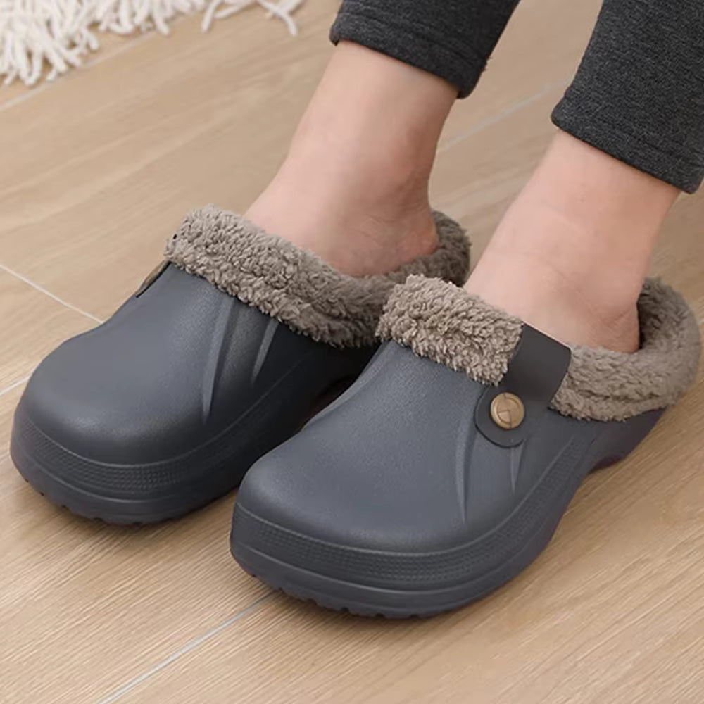 Grace Gray clog slippers with plush lining, closed toes, side button details, open backs, and thick textured soles