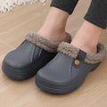 Grace Gray clog slippers with plush lining, closed toes, side button details, open backs, and thick textured soles