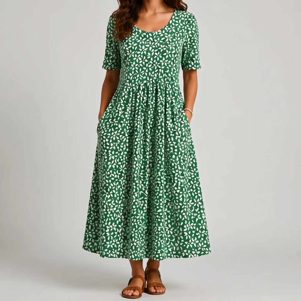 Green leaf print maxi dress with short sleeves and pockets front view BELLA HUDSON
