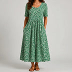Green leaf print maxi dress with short sleeves and pockets front view BELLA HUDSON