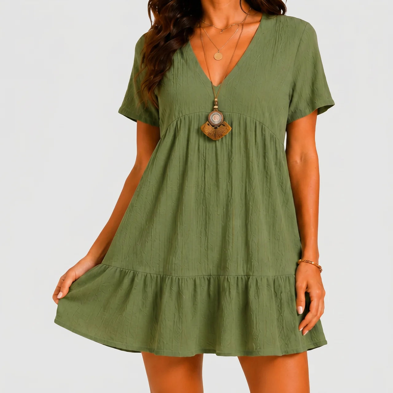 Front view of olive green tiered mini dress with V-neckline and short sleeves by BELLA HUDSON