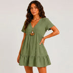 Side view of olive green tiered mini dress with relaxed fit by BELLA HUDSON