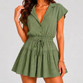 Front view of green tiered romper with drawstring waist and cap sleeves by BELLA HUDSON