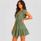 Side view of green tiered romper with drawstring waist and cap sleeves by BELLA HUDSON