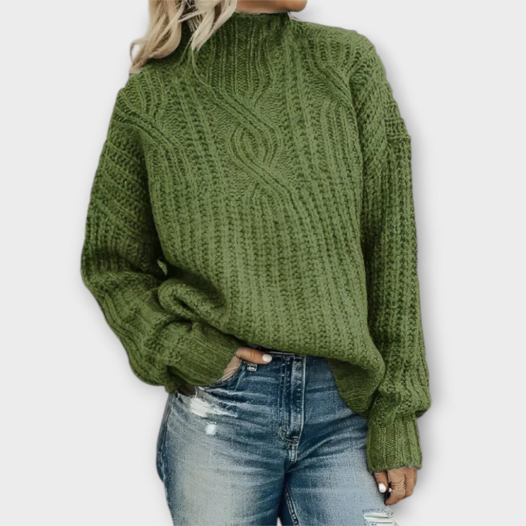 Front view of the Halvard Sweater Cable-Knit Turtleneck in green, featuring a high turtleneck, textured cable-knit pattern, long sleeves, and a relaxed cozy silhouette. Designed by Bella Hudson.