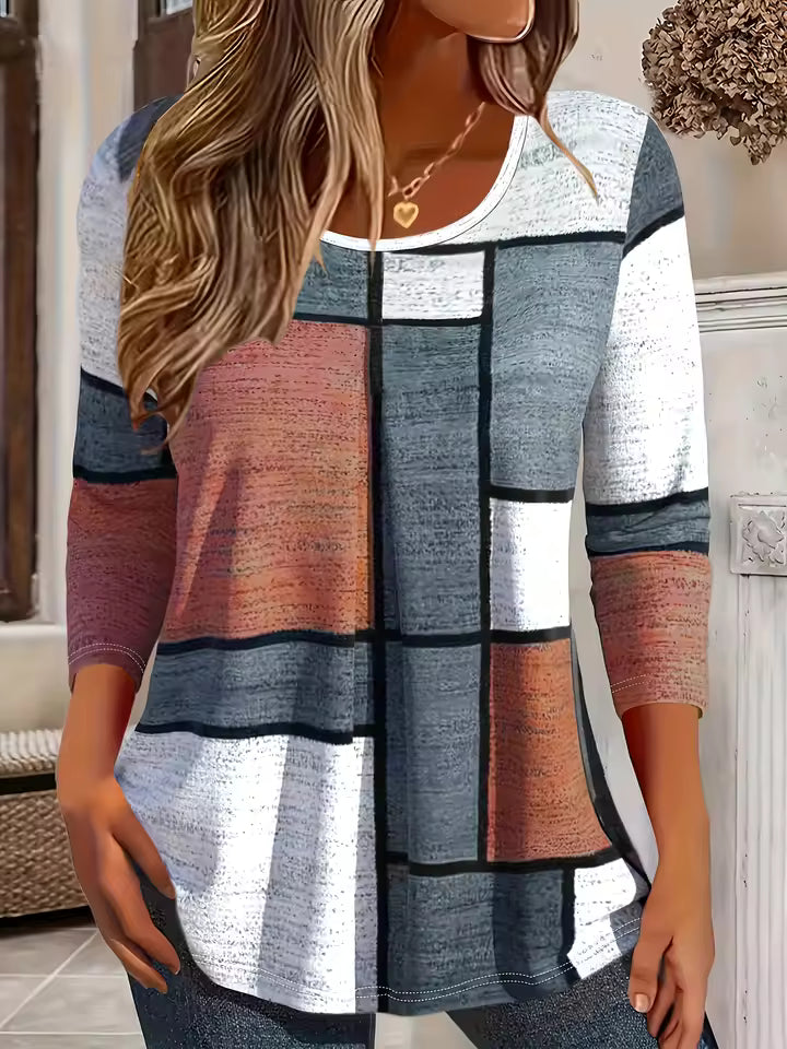 Hannah Brown geometric colorblock tunic top with round neckline, long sleeves, and relaxed fit