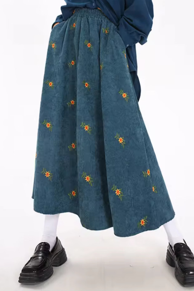 Hazel Green embroidered corduroy midi skirt shown in a full-length front view