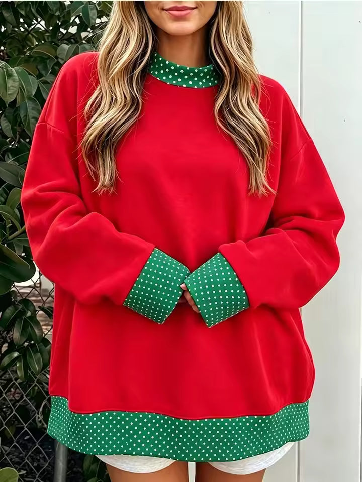 Hazel Red oversized sweatshirt with contrasting polka-dot neckline, long sleeves, patterned cuffs, and matching hem trim