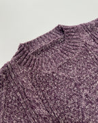 Helene Purple cable-textured sweater dress shown in close-up with detailed geometric knit texture and round neckline
