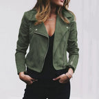 Front view of the Ingeborg Jacket Suede Cropped in green, featuring a wide lapel collar, asymmetric zip-front closure, long sleeves, and a fitted biker-inspired silhouette. Designed by Bella Hudson.