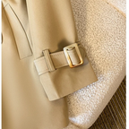 Close-up cuff detail of the Jennifer Trench Coat Belted Double-Breasted in khaki, showcasing the adjustable buckle strap and structured long sleeve. Designed by Bella Hudson.
