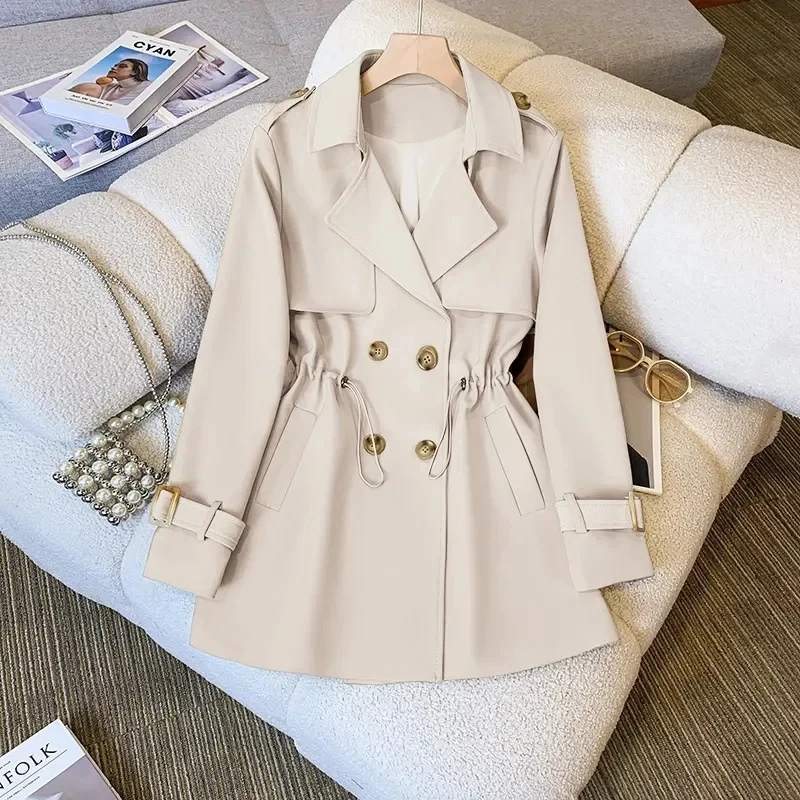 Product view of the Jennifer Trench Coat Belted Double-Breasted in white, featuring a notched lapel collar, double-breasted button front, long sleeves, belted waist, and structured flared silhouette. Designed by Bella Hudson.