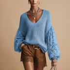 Front view of the Josefine Sweater Lace V-Neck Knit in Blue, featuring a delicate lace V-neckline, soft knit fabric, and long sleeves. Designed by Bella Hudson.