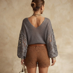 Back view of the Josefine Sweater Lace V-Neck Knit in Grey, highlighting its soft knit texture and relaxed silhouette. Designed by Bella Hudson.