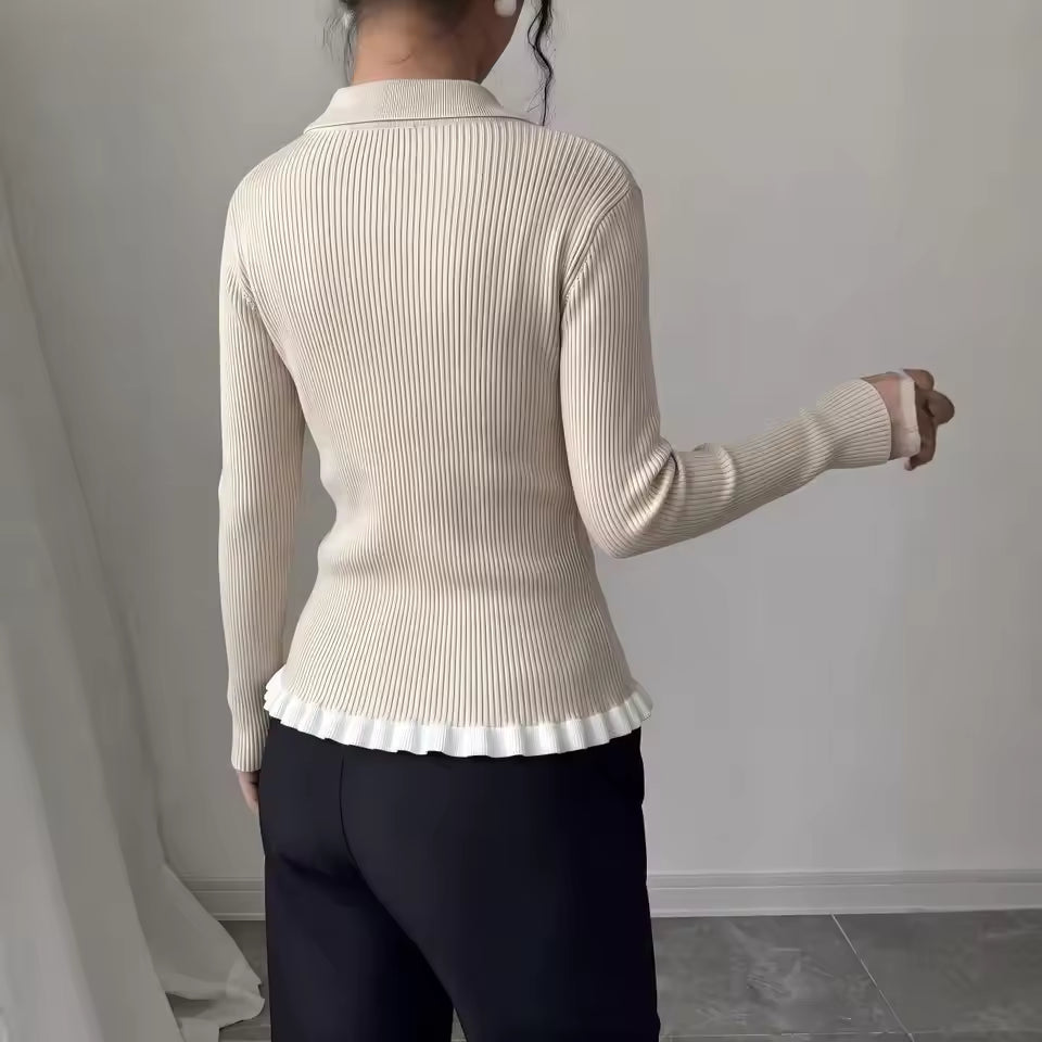 Juliet Beige ribbed knit cardigan shown from the back, featuring long sleeves, a fitted silhouette, and ruffled hem