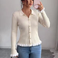Juliet Beige ribbed knit cardigan with pointed collar, button-front closure, long sleeves, and ruffled hem