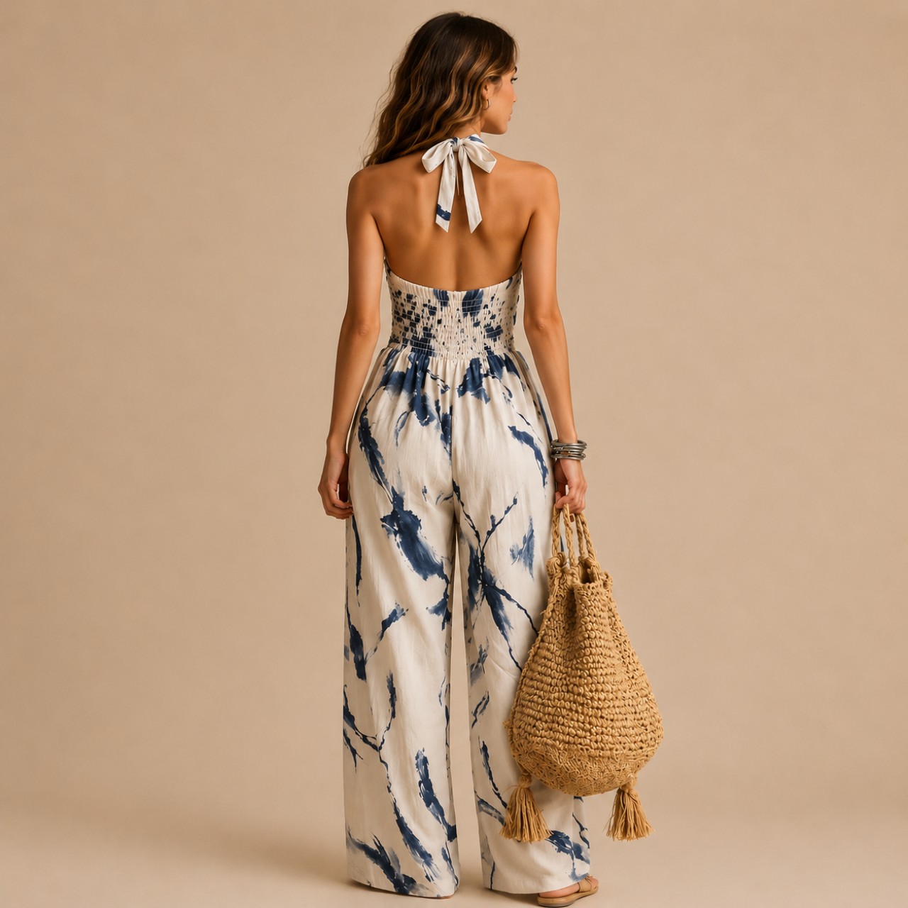 Back view of the Juno Flowy Floral-Print Halter Maxi Dress in light blue featuring a halter tie neckline, smocked back detail, flowing silhouette, and maxi-length design. Designed by Bella Hudson.