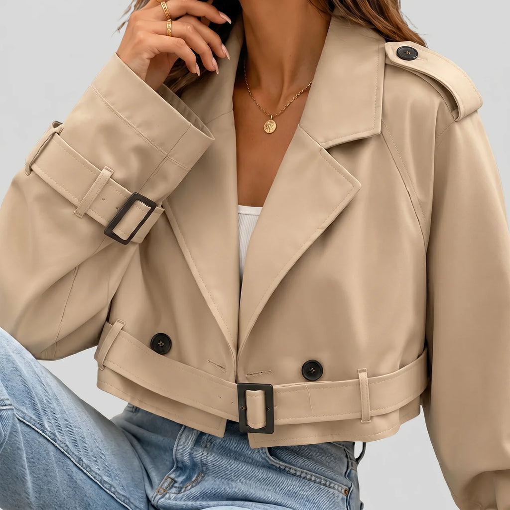 Close-up view of khaki cropped trench jacket with buckle belt and long sleeves by BELLA HUDSON