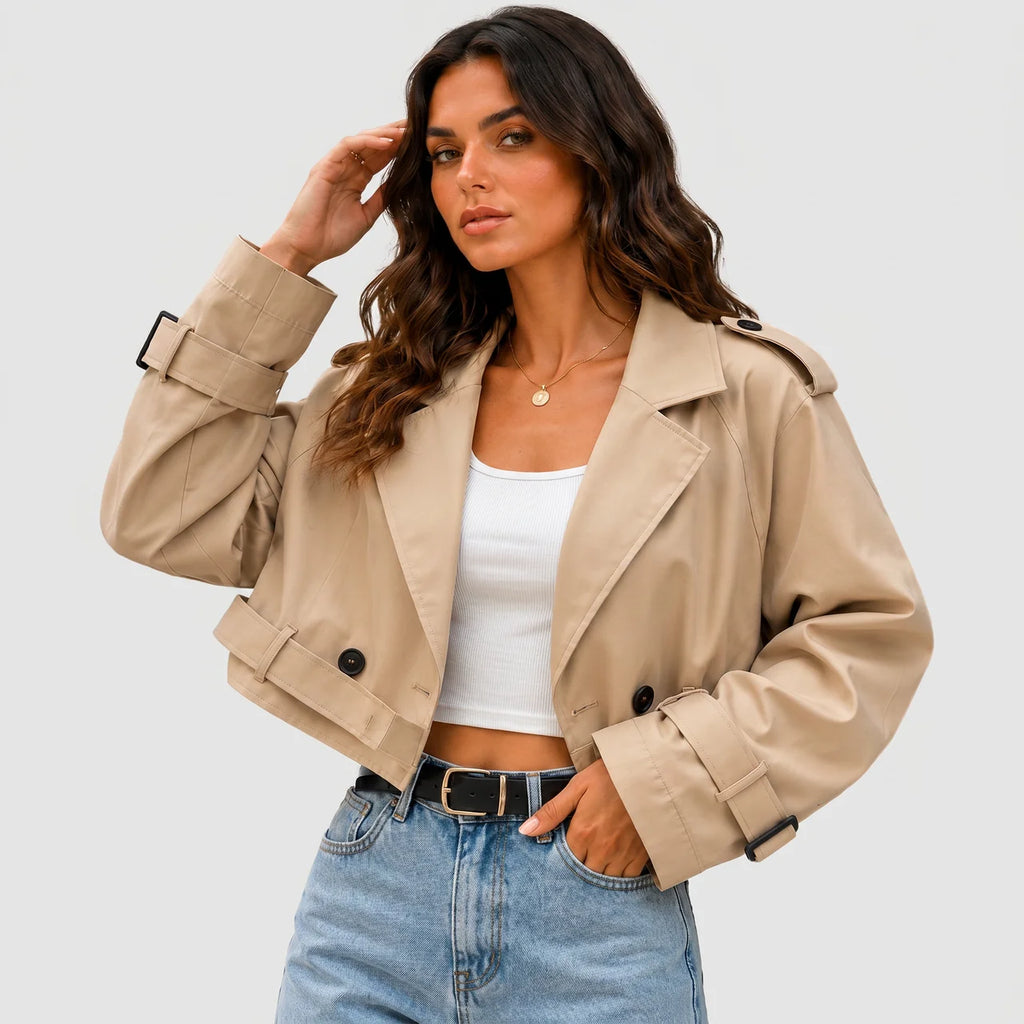 Model wearing khaki cropped trench jacket with buckle belt and long sleeves by BELLA HUDSON
