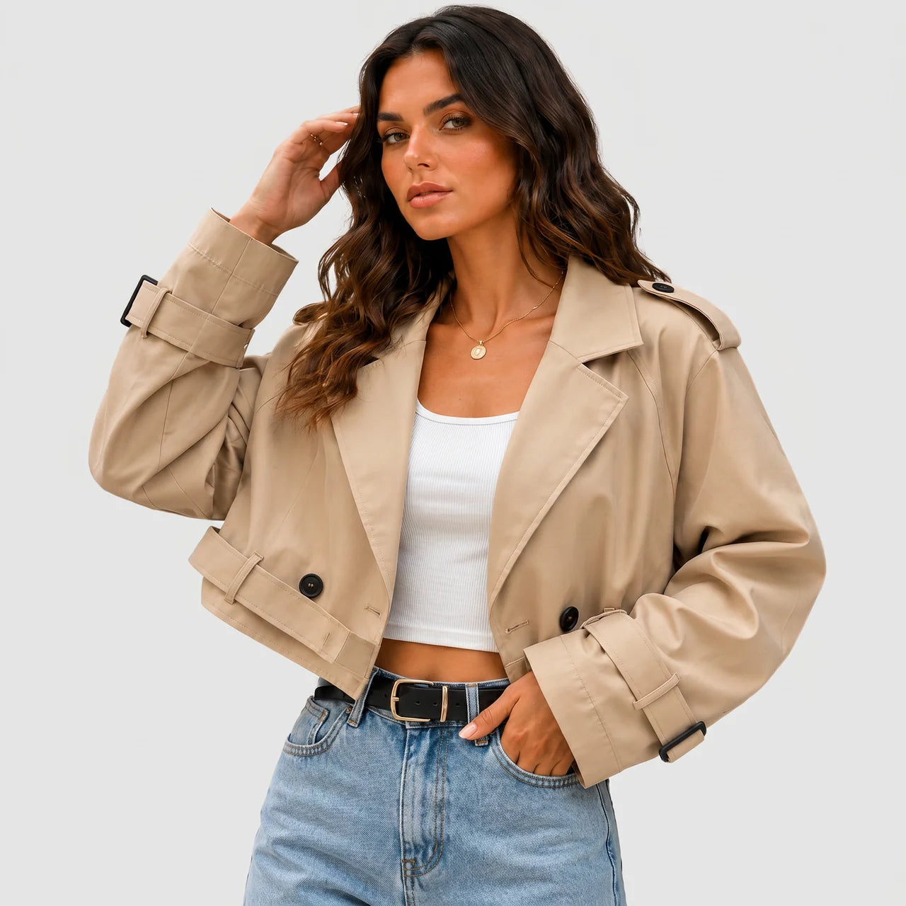 Model wearing khaki cropped trench jacket with buckle belt and long sleeves by BELLA HUDSON