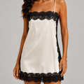 Front view of Lazarus satin lace sleeveless evening mini dress with ivory satin fabric and black lace trim by BELLA HUDSON