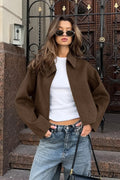 Lena Brown cropped jacket featuring a turn-down collar, relaxed fit, long sleeves, and zip-front closure