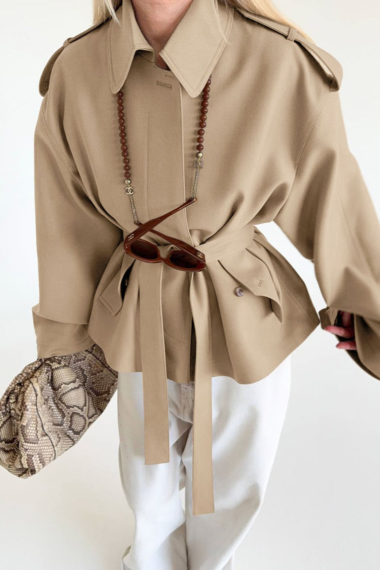 Lena Brown faux suede belted short jacket with a lapel collar, shoulder tabs, long sleeves, and defined tie waist