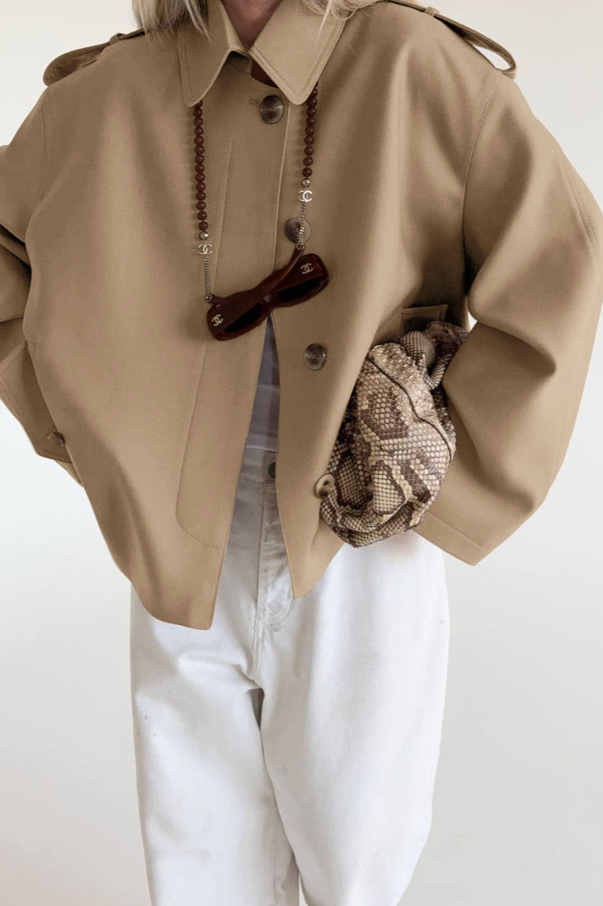 Lena Brown faux suede belted jacket in a relaxed front view with long sleeves, lapel collar, and waist tie